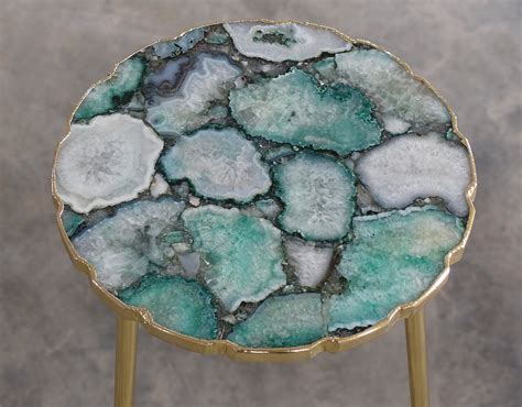 Agate table - All table measurements are approximate and are taken from the longest measurement. This table can be used as a coffee table or side table, comes complete with glass top to fit over the gorgeous agate feature slice. This agate slice is 53cm long and 38cm wide in diameter and the agate piece is 3cm thick.
